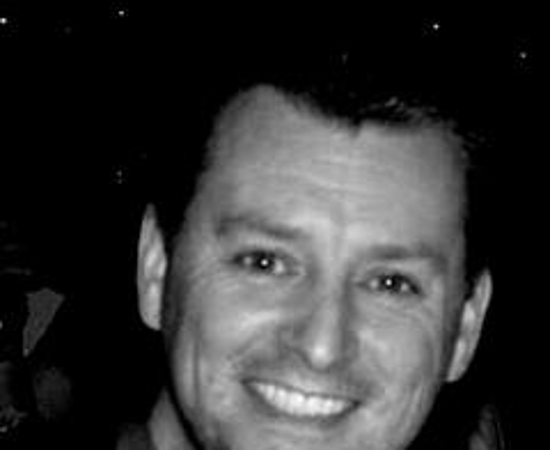 Headshot of Alan White