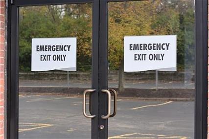 Emergency exit signs and maps that are compliant