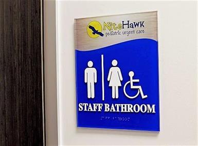 A collection of restroom signs and graphics that are ADA-compliant