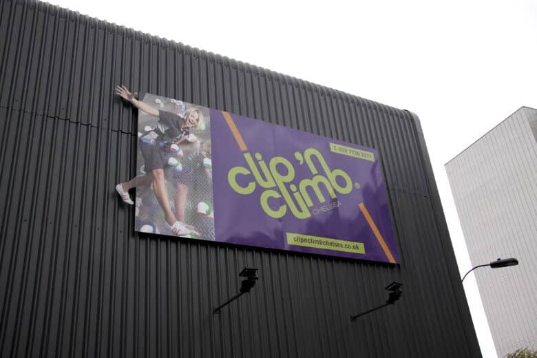 large custom banner hanging outside of building