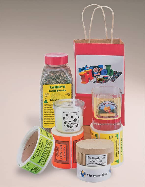 rolls of custom sticker labels on spices, bags, and containers