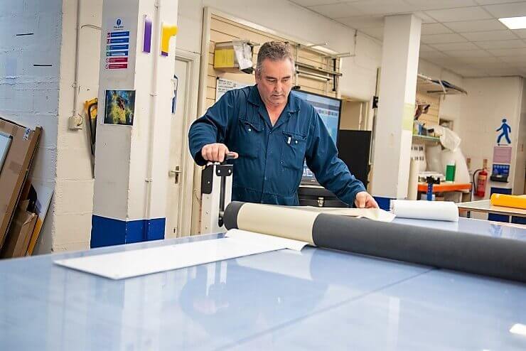 Man working on signages