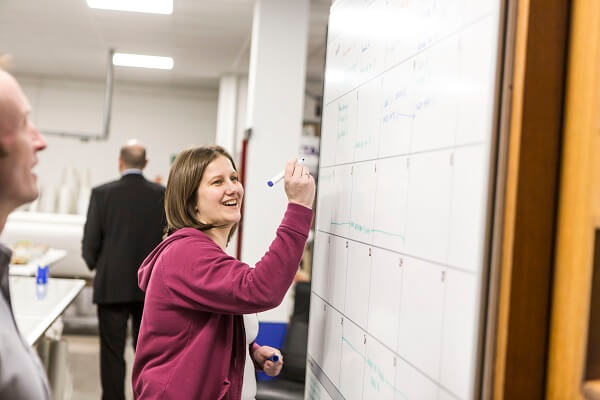 Rebecca Holliday writing on a board