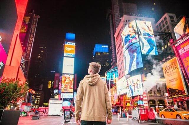 guy looking at digital signs